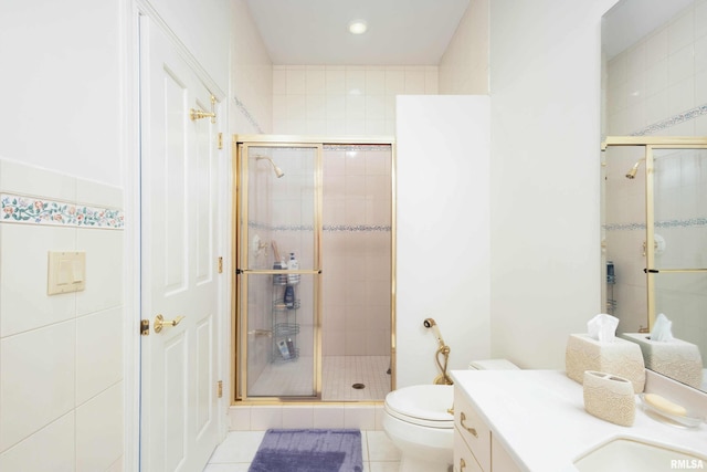 bathroom with tile patterned flooring, vanity, and an enclosed shower