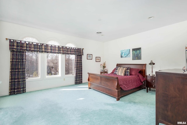 bedroom featuring light carpet