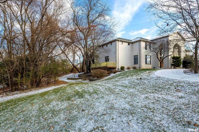 snow covered property featuring a yard