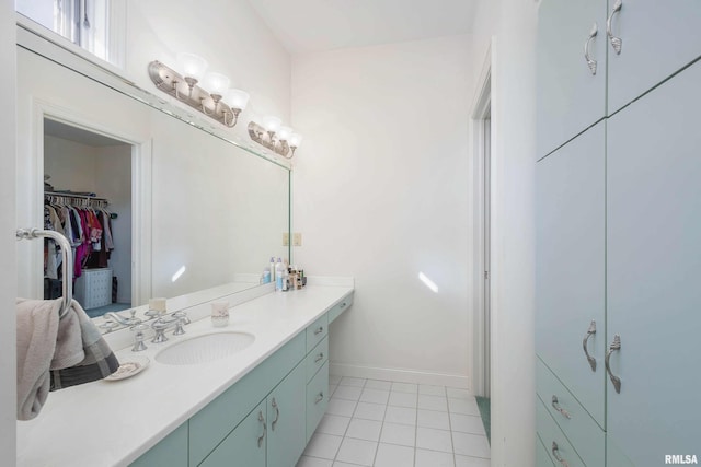 bathroom featuring tile patterned flooring and vanity