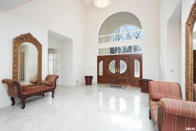 foyer with a towering ceiling