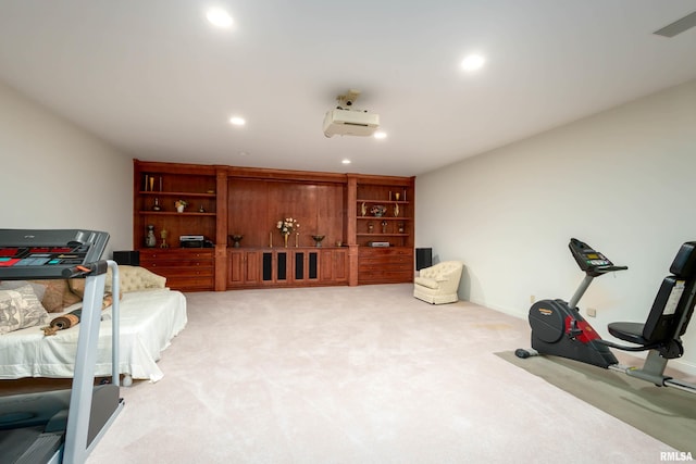 workout room featuring light colored carpet