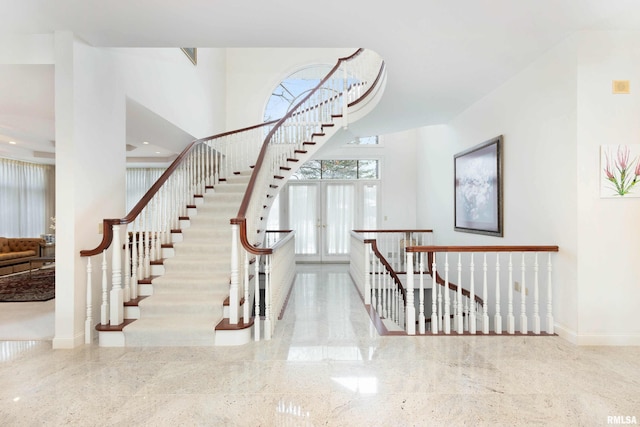 staircase with french doors