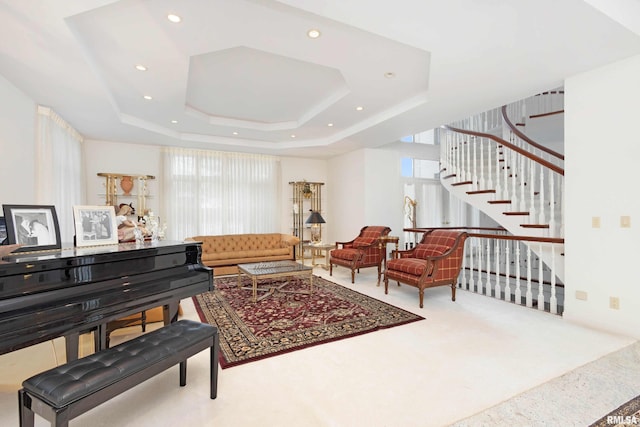 interior space featuring carpet floors and a tray ceiling