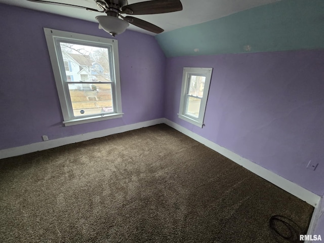 additional living space featuring a ceiling fan, carpet, lofted ceiling, and baseboards