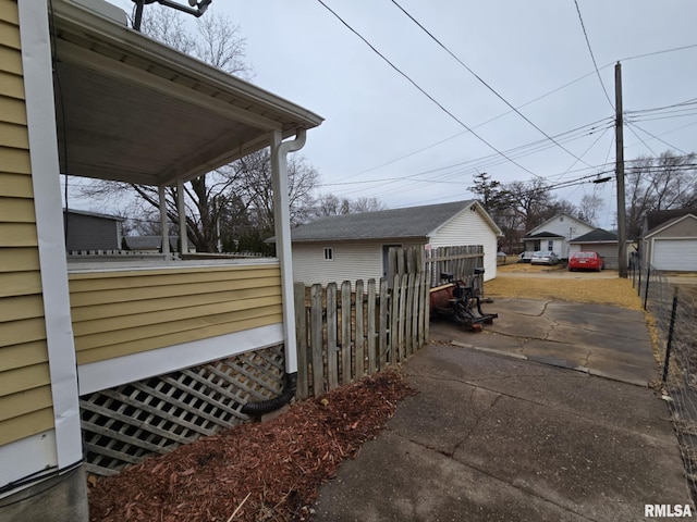 view of side of home with fence