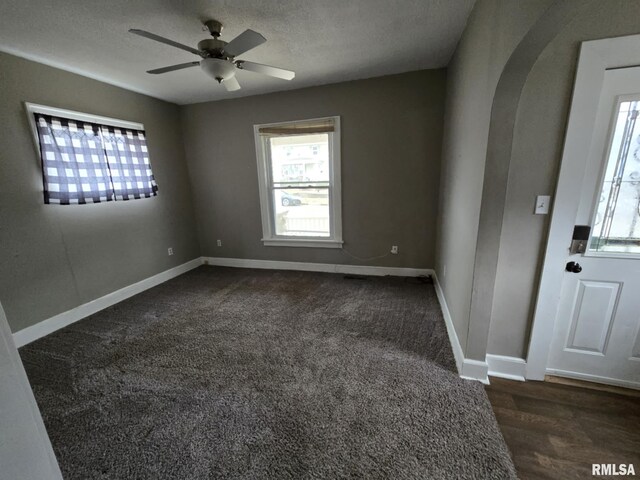 bedroom featuring ceiling fan, lofted ceiling, and dark colored carpet