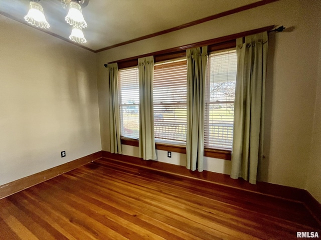 1812 E 1650th St, Paloma, IL 62359 - unfurnished room featuring hardwood / wood-style floors and crown molding