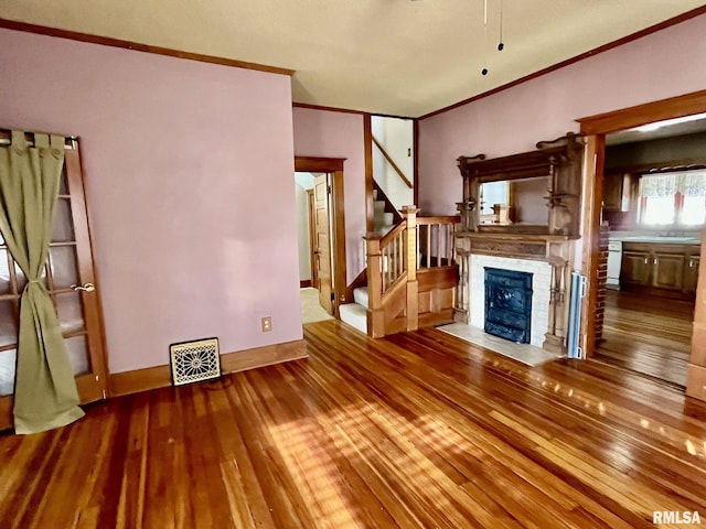 1812 E 1650th St, Paloma, IL 62359 - unfurnished living room with wood-type flooring and ornamental molding