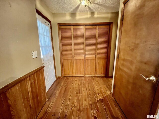 1812 E 1650th St, Paloma, IL 62359 - doorway with a textured ceiling and light hardwood / wood-style floors
