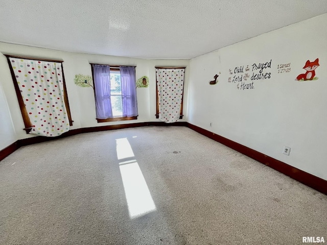 1812 E 1650th St, Paloma, IL 62359 - empty room featuring carpet floors and a textured ceiling