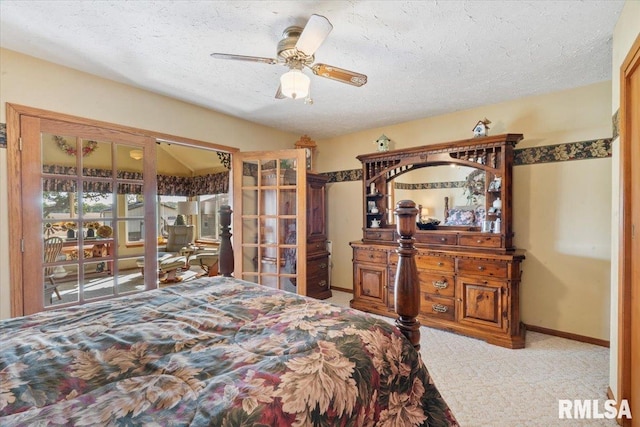 bedroom featuring ceiling fan, light carpet, and a textured ceiling