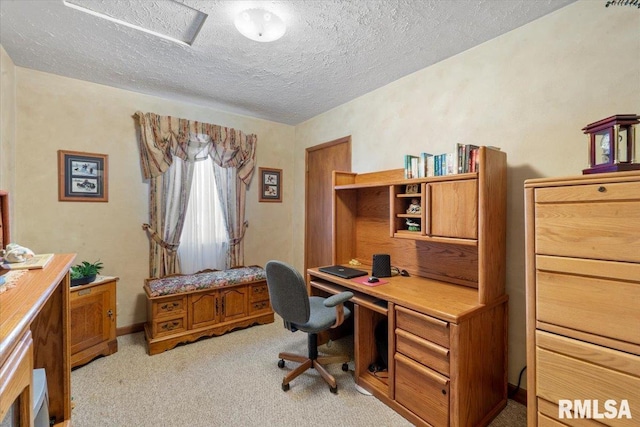 office with light carpet and a textured ceiling