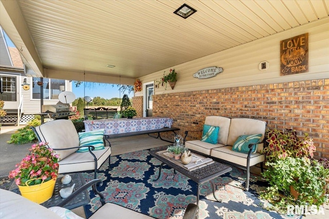 view of patio / terrace with covered porch, an outdoor hangout area, and grilling area