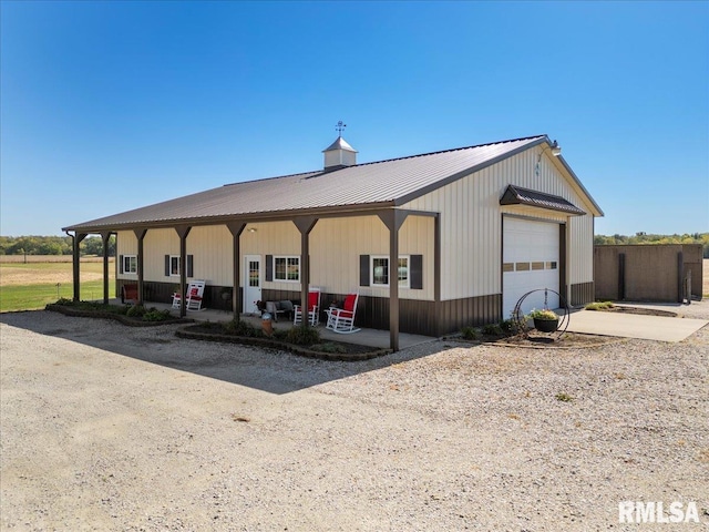 view of front of house with a porch and a garage