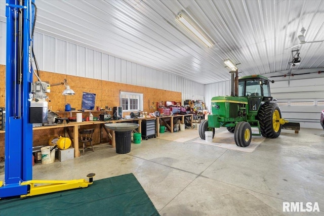 garage with a workshop area and a garage door opener