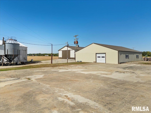 exterior space with an outbuilding and a garage