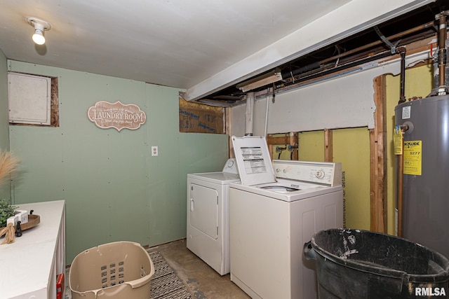 washroom with washing machine and dryer and gas water heater