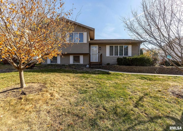 tri-level home featuring a front yard