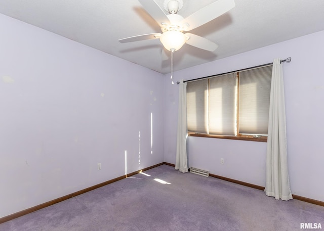 empty room with carpet flooring and ceiling fan