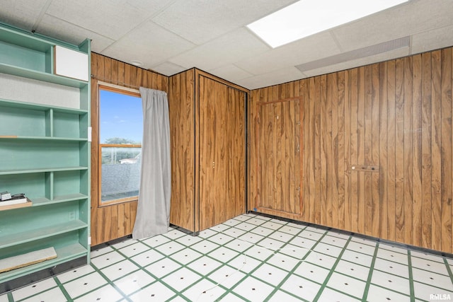 empty room featuring wooden walls