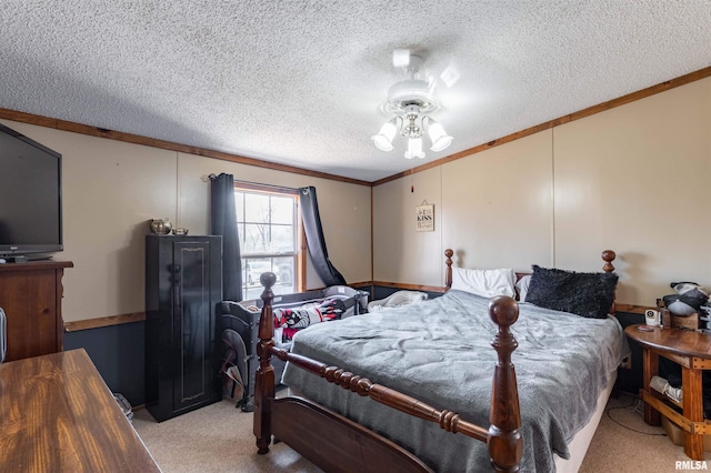 carpeted bedroom with crown molding and a textured ceiling