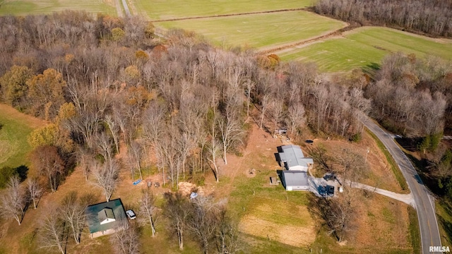 birds eye view of property with a rural view