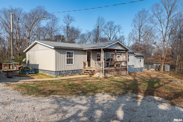 manufactured / mobile home featuring covered porch