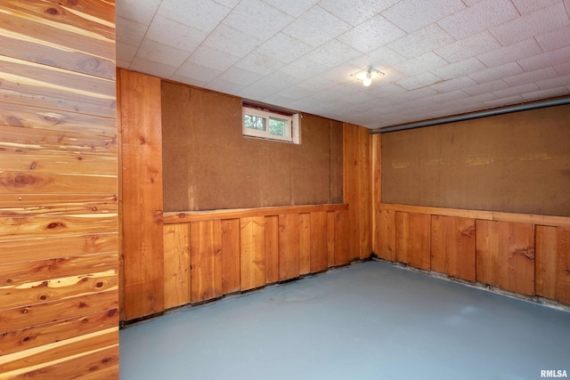 basement with wood walls