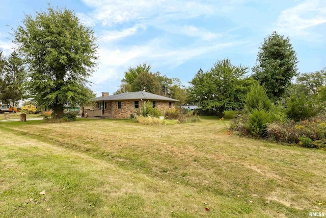 view of yard featuring a wooden deck