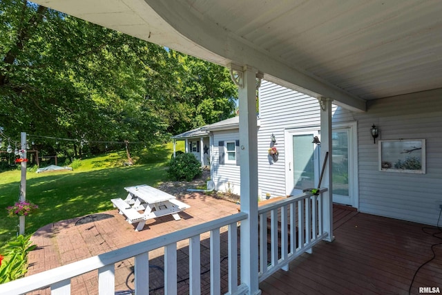 wooden deck with a yard