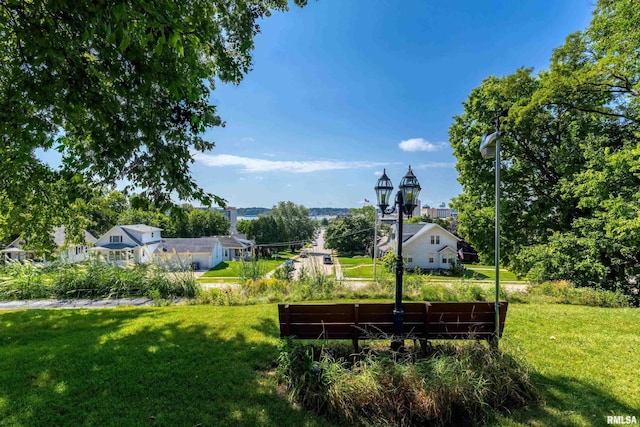 surrounding community featuring a lawn