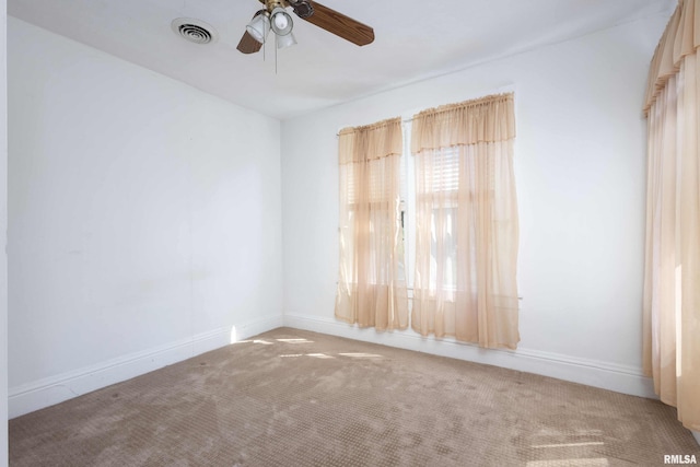 unfurnished room featuring carpet and ceiling fan