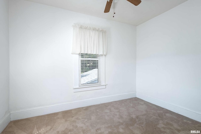 unfurnished room with carpet and ceiling fan