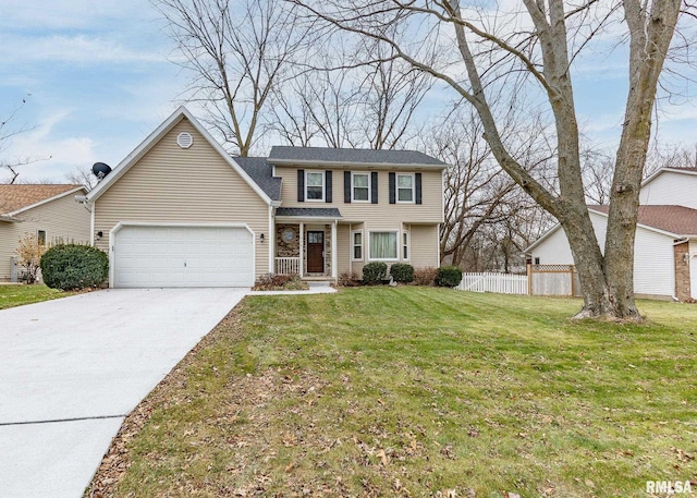 view of front of house with a front yard and a garage