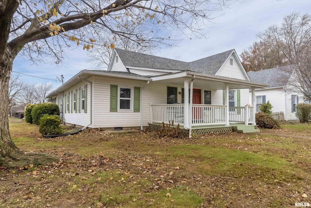 view of side of property featuring a porch