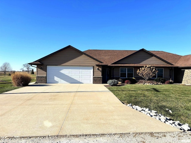 ranch-style home with a garage and a front lawn