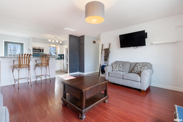 living room with dark hardwood / wood-style floors