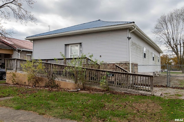 view of side of home featuring a deck