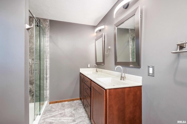 bathroom with vanity and an enclosed shower