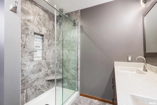 bathroom with vanity and an enclosed shower