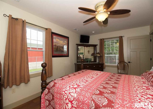bedroom featuring hardwood / wood-style flooring and ceiling fan