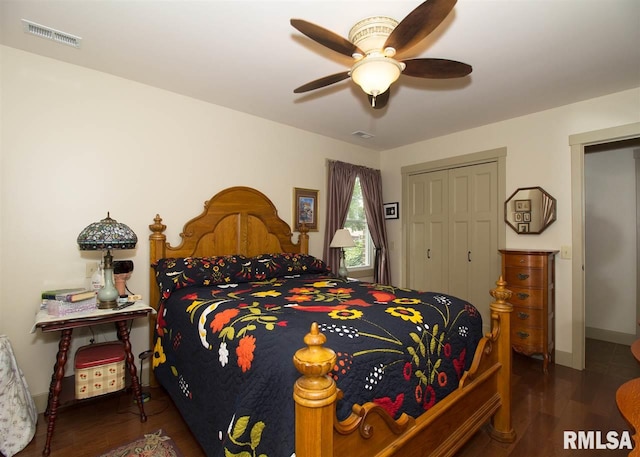 bedroom with ceiling fan, a closet, and dark hardwood / wood-style floors