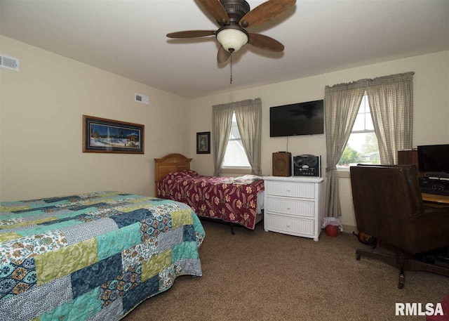 bedroom featuring carpet flooring, multiple windows, and ceiling fan