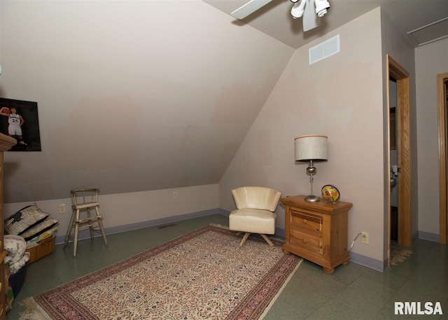sitting room with ceiling fan and lofted ceiling