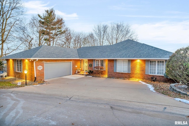 single story home with a garage