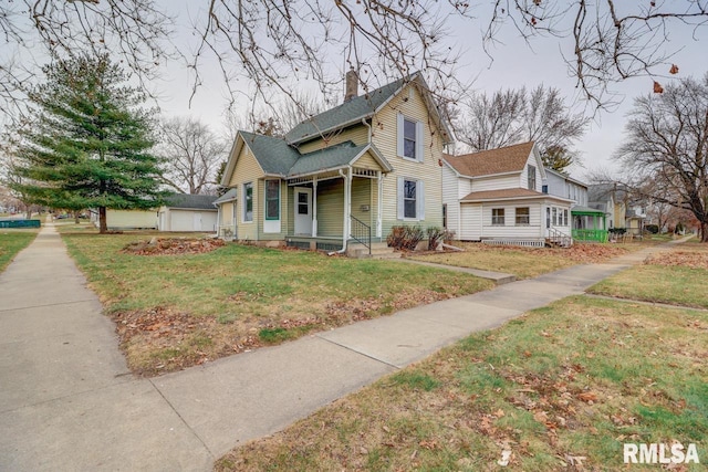 1700 Pershing Blvd, Clinton, IA 52732 - view of front facade with covered porch, a chimney, a front yard, and roof with shingles