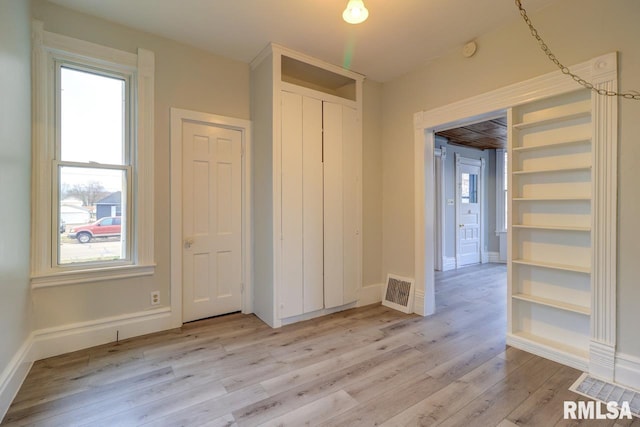 unfurnished bedroom with light hardwood / wood-style flooring