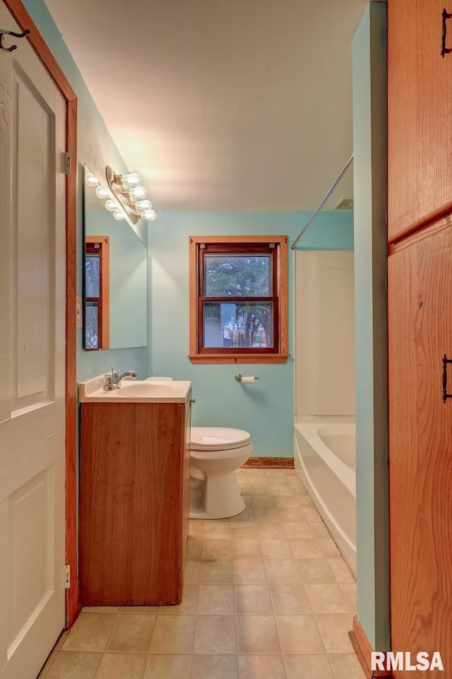 full bathroom featuring tile patterned flooring, vanity, toilet, and tub / shower combination