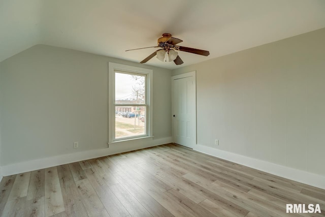 additional living space with ceiling fan, vaulted ceiling, and light hardwood / wood-style flooring